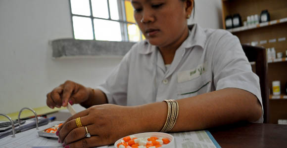A Doctor at Sya Health Center in Sampov Meas, Pursat Province, meets with one of many patients